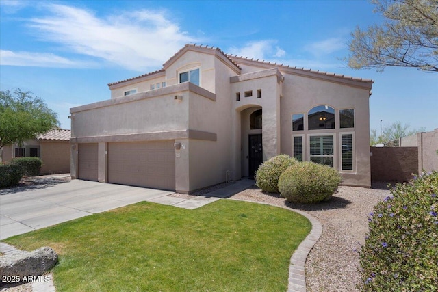 mediterranean / spanish-style house featuring a garage, fence, stucco siding, concrete driveway, and a tile roof