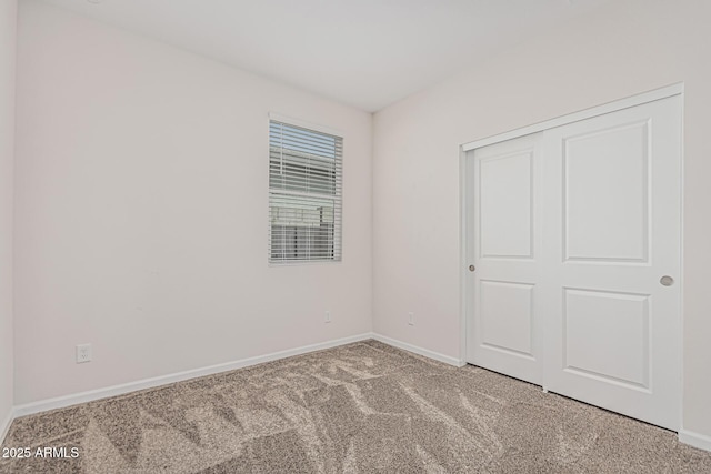 17376 W Via De Luna Dr, Surprise, AZ 85387 - unfurnished bedroom featuring a closet, baseboards, and carpet flooring