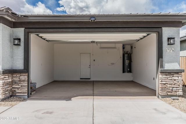 17376 W Via De Luna Dr, Surprise, AZ 85387 - garage with concrete driveway and electric water heater