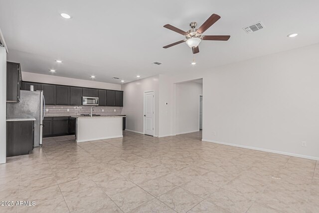 17376 W Via De Luna Dr, Surprise, AZ 85387 - unfurnished living room featuring recessed lighting, ceiling fan, visible vents, and baseboards