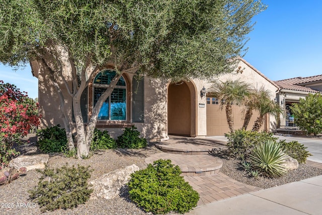 view of front of property with a garage