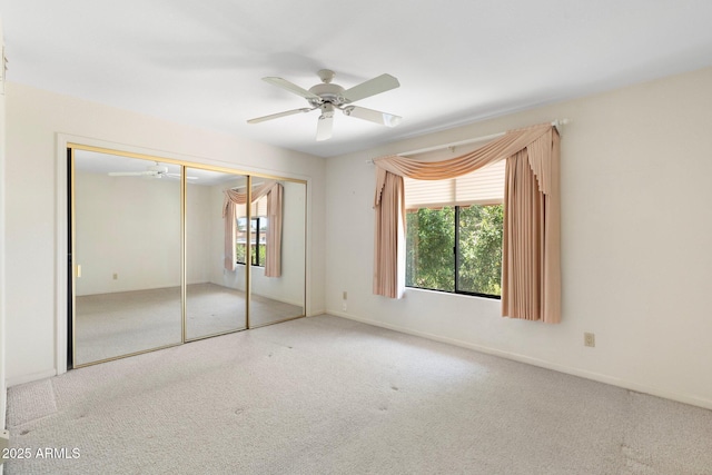 1338 E Greenway Cir, Mesa, AZ 85203 - unfurnished bedroom featuring multiple windows, carpet floors, and a closet