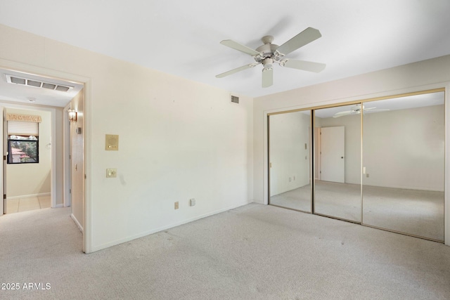 1338 E Greenway Cir, Mesa, AZ 85203 - unfurnished bedroom with carpet flooring, a closet, and a ceiling fan