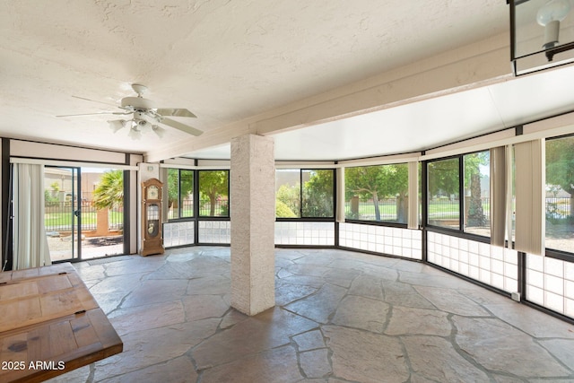 1338 E Greenway Cir, Mesa, AZ 85203 - unfurnished sunroom with stone floors and a textured ceiling