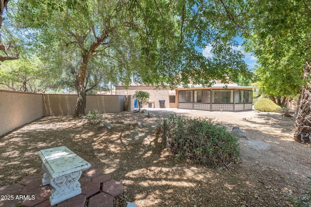 1338 E Greenway Cir, Mesa, AZ 85203 - fenced backyard with a sunroom