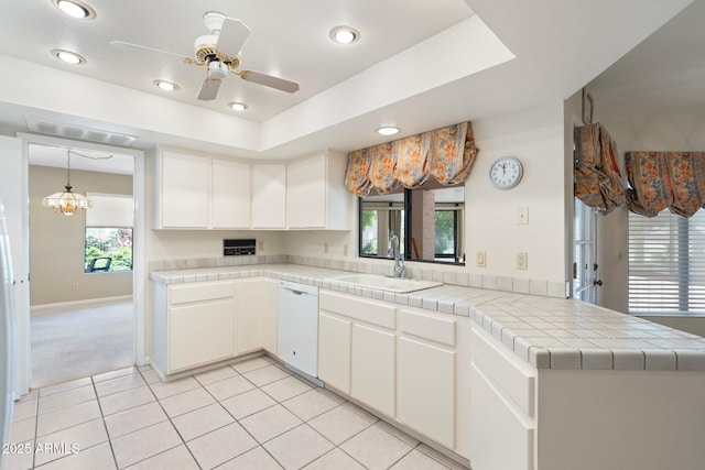 1338 E Greenway Cir, Mesa, AZ 85203 - kitchen with white dishwasher, light tile patterned floors, white cabinets, ceiling fan, and a peninsula