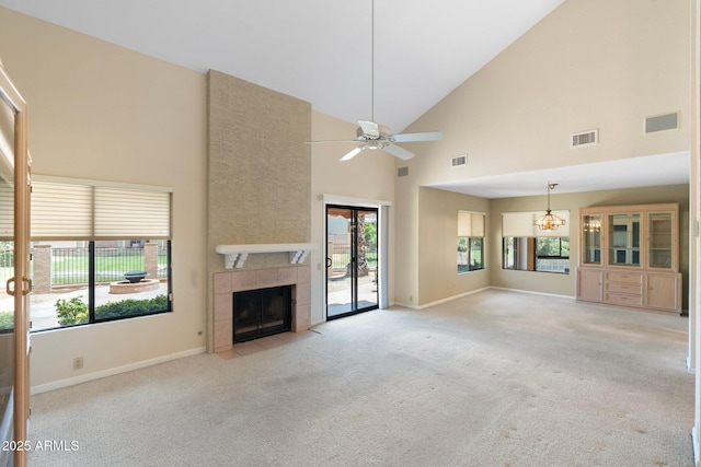 1338 E Greenway Cir, Mesa, AZ 85203 - unfurnished living room with a tiled fireplace, light colored carpet, high vaulted ceiling, and ceiling fan