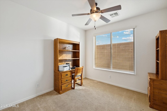 carpeted office with ceiling fan