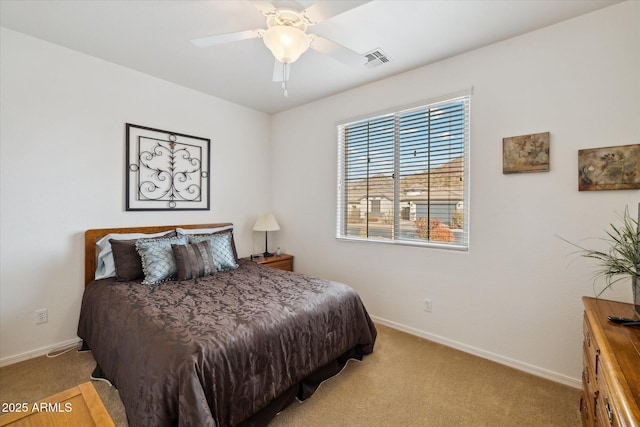 bedroom featuring ceiling fan and light colored carpet