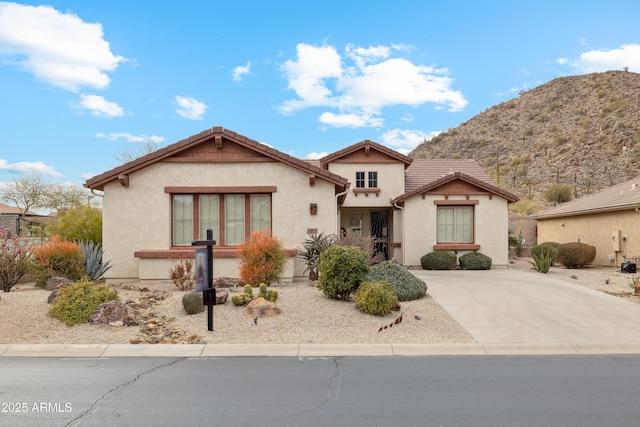 view of front of property with a mountain view