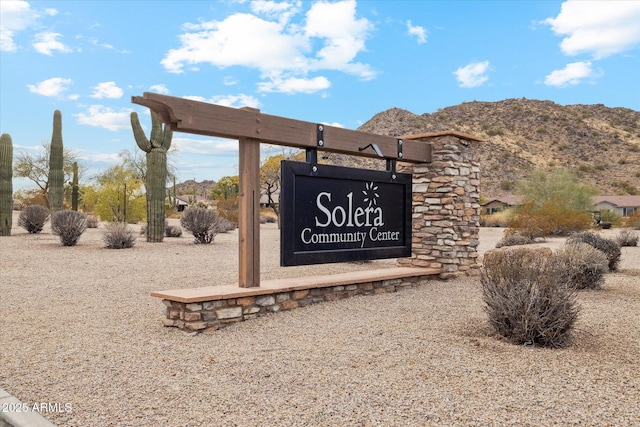 community sign featuring a mountain view