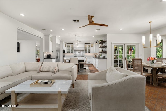 5112 N 41st St, Phoenix, AZ 85018 - living room with recessed lighting, a ceiling fan, and a chandelier
