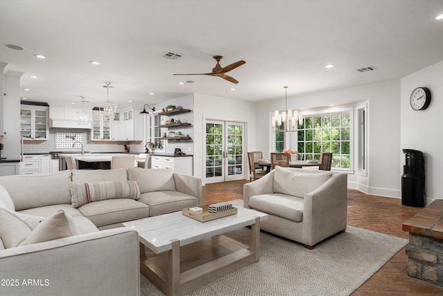 5112 N 41st St, Phoenix, AZ 85018 - living area featuring a chandelier, healthy amount of natural light, ceiling fan, recessed lighting, and baseboards