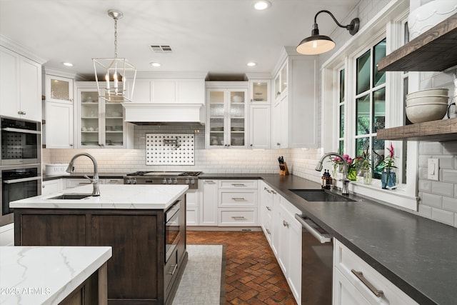 5112 N 41st St, Phoenix, AZ 85018 - kitchen with open shelves, a sink, stainless steel appliances, brick patterned floors, and decorative backsplash