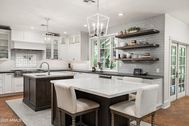 5112 N 41st St, Phoenix, AZ 85018 - kitchen featuring an island with sink, a sink, decorative backsplash, recessed lighting, and a chandelier
