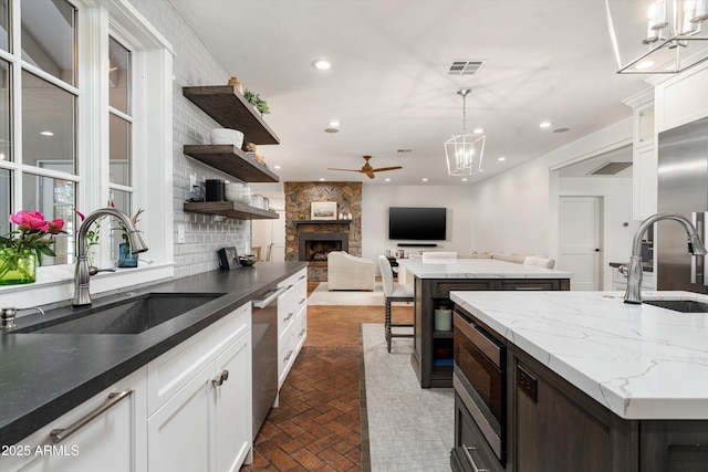 5112 N 41st St, Phoenix, AZ 85018 - kitchen featuring a sink, ceiling fan, stainless steel appliances, a center island, and recessed lighting