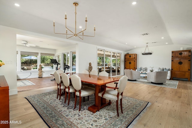 5112 N 41st St, Phoenix, AZ 85018 - dining area featuring vaulted ceiling, recessed lighting, light wood-type flooring, and a chandelier