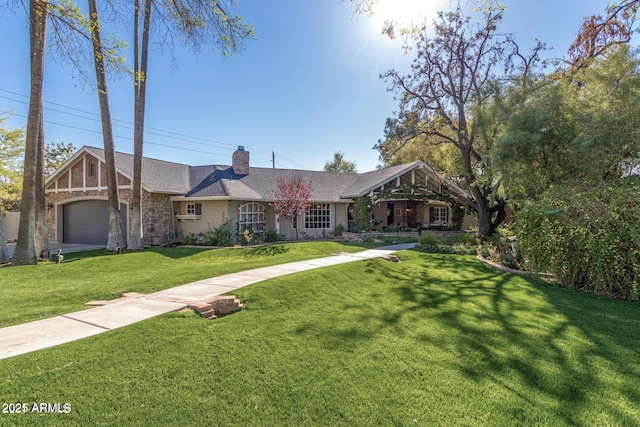5112 N 41st St, Phoenix, AZ 85018 - view of front of house with stone siding, a front lawn, a chimney, and a garage