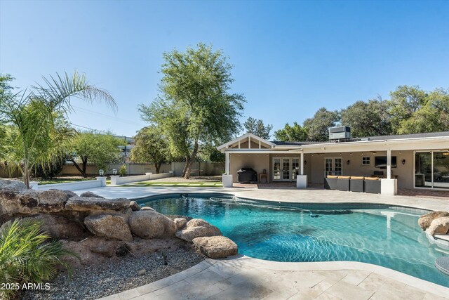 5112 N 41st St, Phoenix, AZ 85018 - view of pool with french doors, a patio, outdoor lounge area, central AC unit, and grilling area