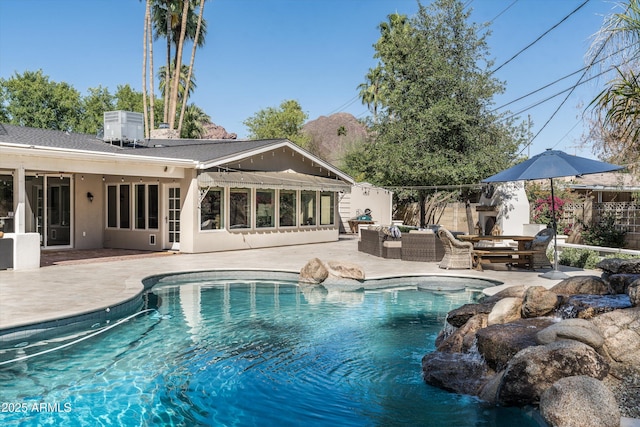 5112 N 41st St, Phoenix, AZ 85018 - view of swimming pool featuring a patio area, an outdoor living space with a fireplace, and central AC unit