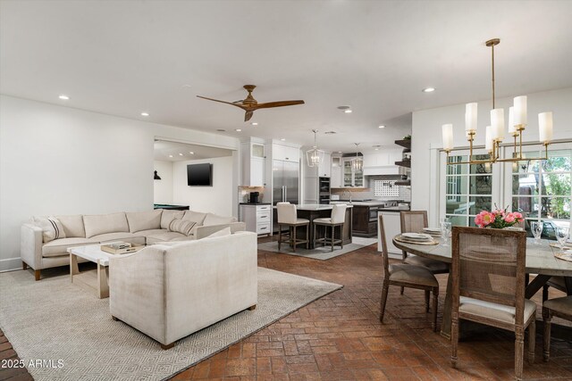 5112 N 41st St, Phoenix, AZ 85018 - living area featuring brick flooring, recessed lighting, a chandelier, and a ceiling fan