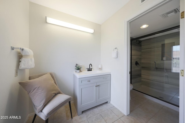 bathroom with visible vents, a stall shower, baseboards, toilet, and tile patterned floors