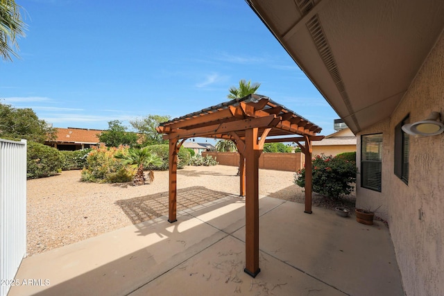 view of patio with a pergola and a fenced backyard