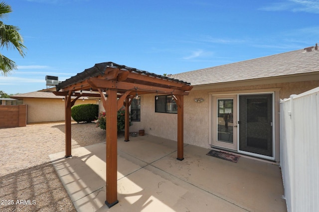 view of patio / terrace featuring fence and a pergola
