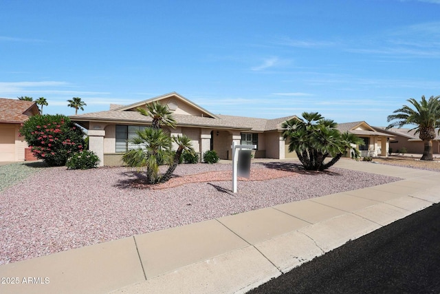single story home featuring driveway