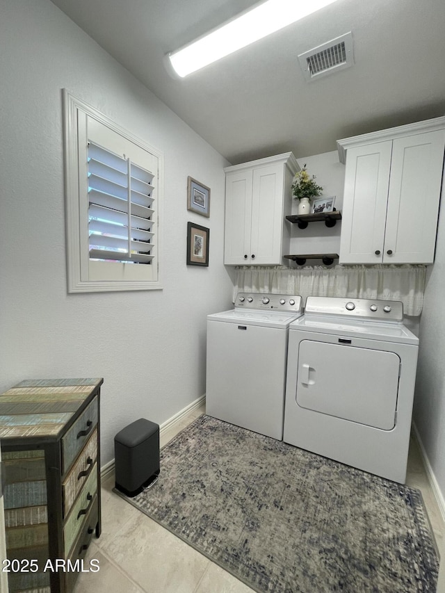 9807 W Mcrae Way, Peoria, AZ 85382 - laundry room with baseboards, light tile patterned floors, visible vents, washing machine and clothes dryer, and cabinet space
