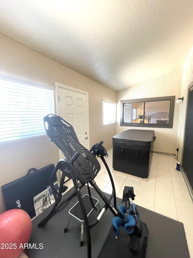 9807 W Mcrae Way, Peoria, AZ 85382 - exercise area with light tile patterned floors, baseboards, and vaulted ceiling