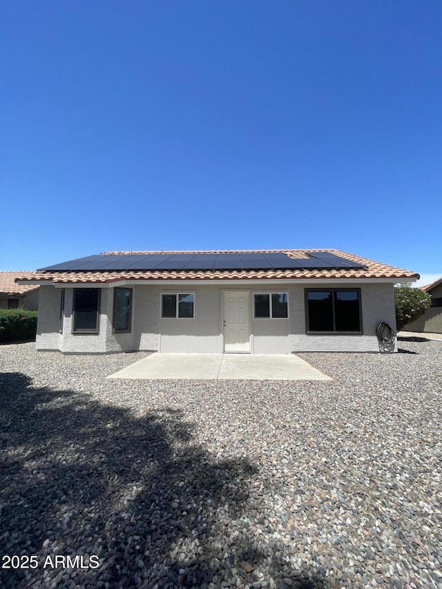 9807 W Mcrae Way, Peoria, AZ 85382 - back of house featuring roof mounted solar panels, a patio, a tiled roof, and stucco siding