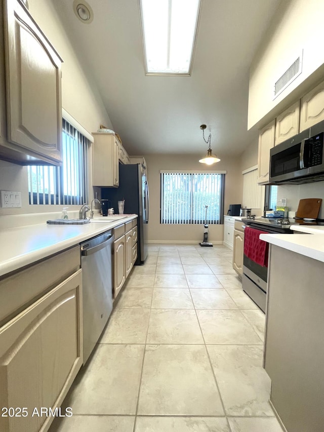 9807 W Mcrae Way, Peoria, AZ 85382 - kitchen with lofted ceiling, light tile patterned floors, visible vents, light countertops, and appliances with stainless steel finishes