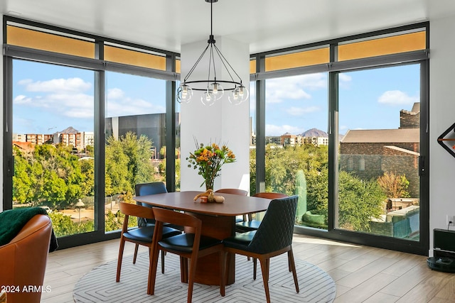 sunroom with a chandelier and a healthy amount of sunlight