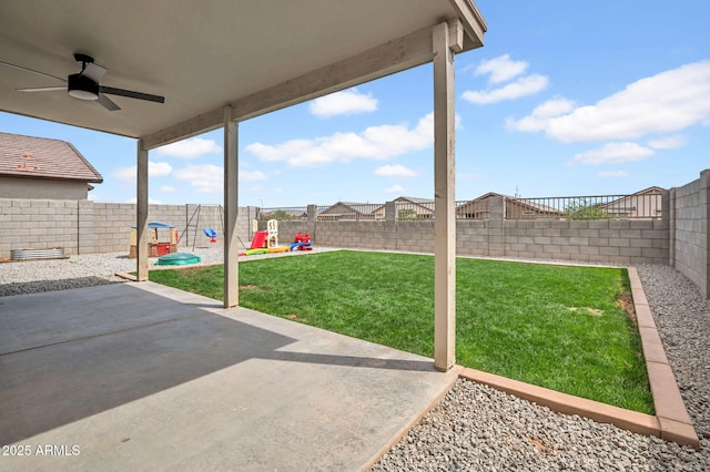 view of yard with ceiling fan, a patio, and a fenced backyard