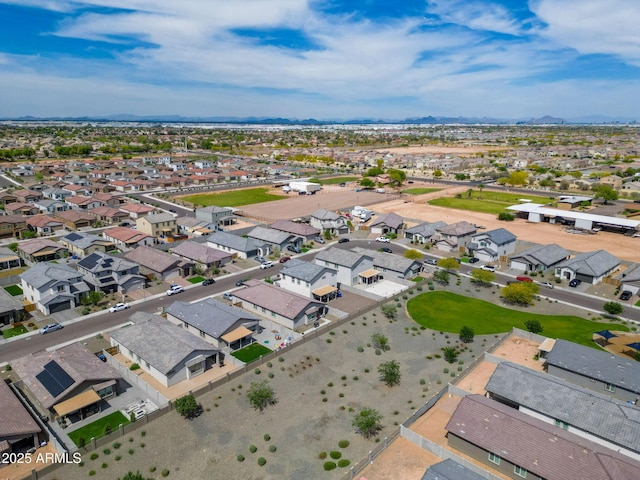 birds eye view of property with a residential view