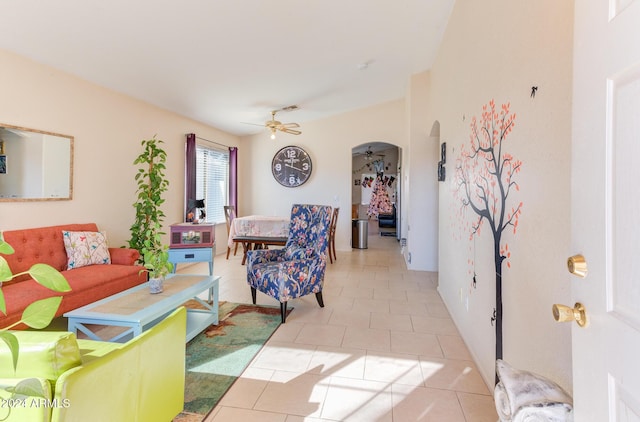 tiled living room featuring ceiling fan