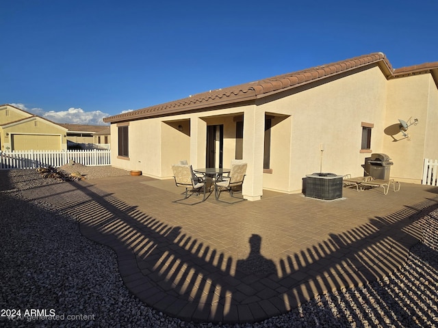 rear view of property featuring a patio area