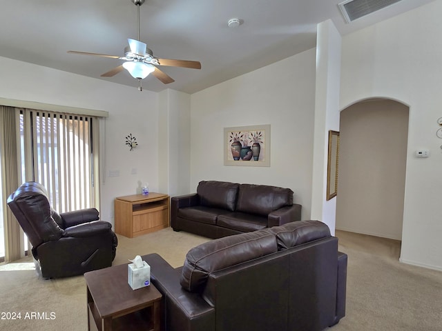 carpeted living room featuring ceiling fan