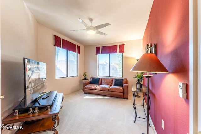 living room featuring light carpet and ceiling fan