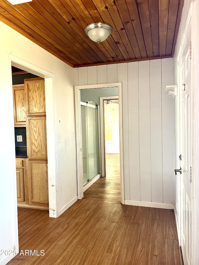 709 W Maple St, Winslow, AZ 86047 - hallway with wooden ceiling, wood finished floors, and baseboards
