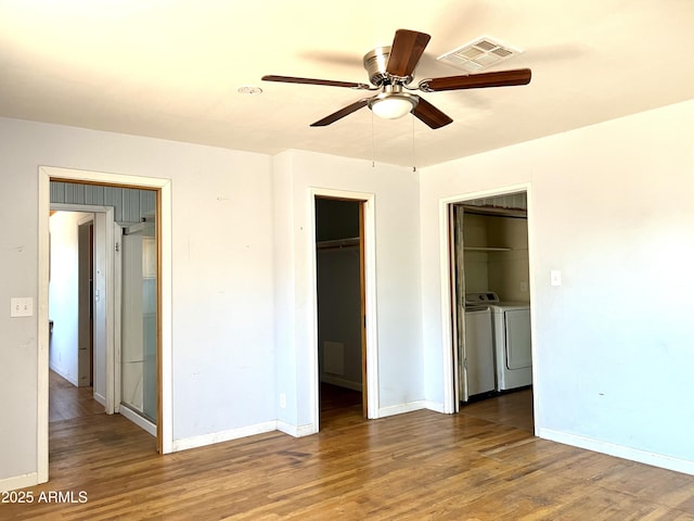 709 W Maple St, Winslow, AZ 86047 - unfurnished bedroom featuring separate washer and dryer, wood finished floors, and baseboards