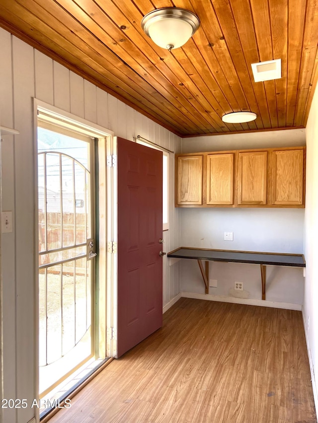 709 W Maple St, Winslow, AZ 86047 - kitchen with wooden ceiling, light wood-type flooring, and baseboards