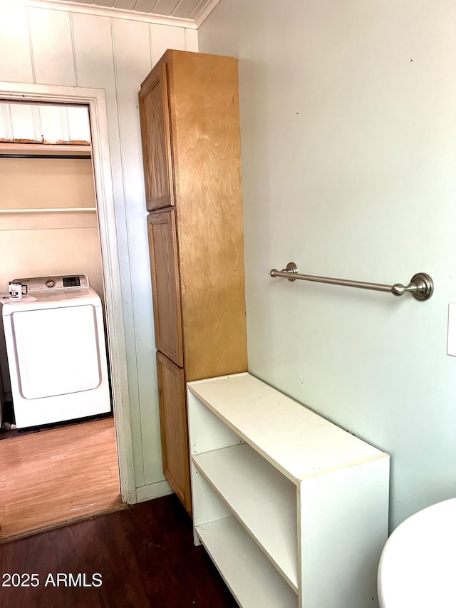 709 W Maple St, Winslow, AZ 86047 - bathroom featuring washer / dryer, toilet, and wood finished floors