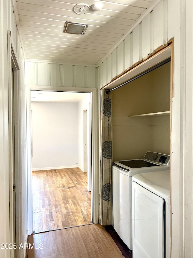 709 W Maple St, Winslow, AZ 86047 - laundry room featuring separate washer and dryer and wood finished floors