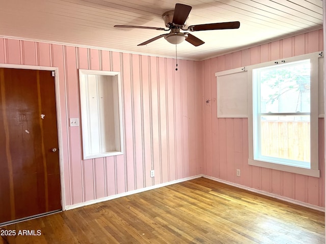 709 W Maple St, Winslow, AZ 86047 - spare room featuring wood finished floors, a ceiling fan, and baseboards