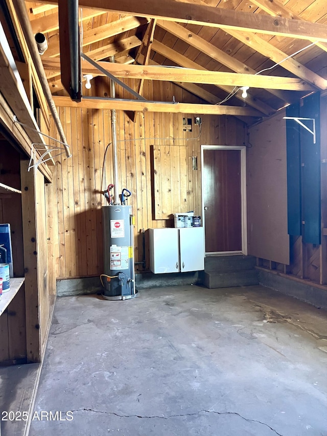709 W Maple St, Winslow, AZ 86047 - garage featuring water heater and wooden walls