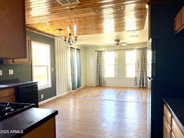 709 W Maple St, Winslow, AZ 86047 - kitchen with dark countertops, black appliances, wooden ceiling, wood finished floors, and a ceiling fan