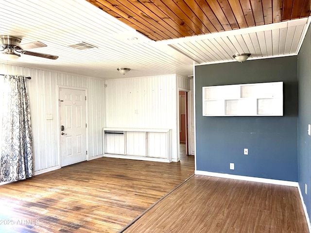 709 W Maple St, Winslow, AZ 86047 - unfurnished room with ceiling fan, wood ceiling, baseboards, and wood finished floors