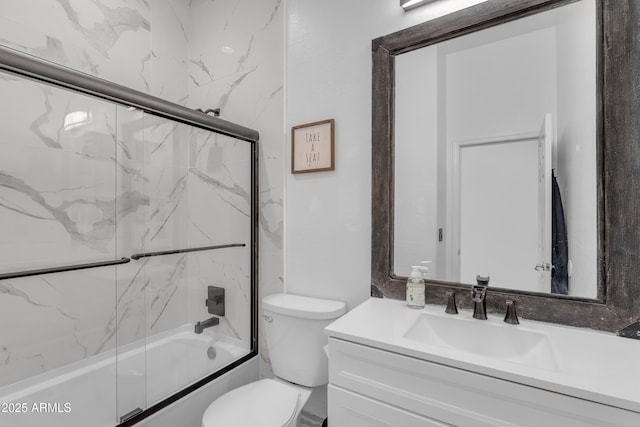 full bath featuring shower / bath combination with glass door, toilet, and vanity